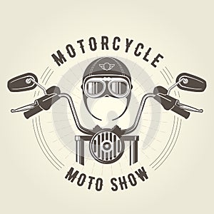 Chopper moto handlebar and vintage motorcycle helmet photo
