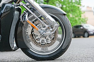 Chopper motorcycle wheel close up. Brake disc on a wheel from a motorcycle close up.