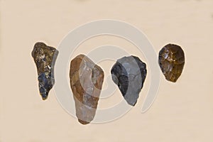 Choppers, scrapers, axes of an ancient man of the Shell culture are isolated on a light background. Paleontology