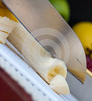 Chopping Banana Represents Bananas Exotic And Bannannas photo