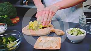 Chopping lettuce leaves for vegetable salad