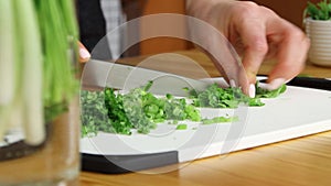 Chopping mint leaves on cutting board