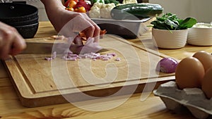 Chopping red onion on cutting board