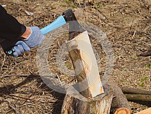 Chopping wood with an ax