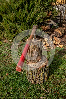 Chopping wood to the fireplace for heating on cold winter days
