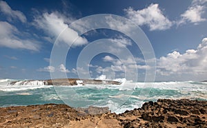 Choppy storm waves crashing into Laie Point coastline at Kaawa on the North Shore of Oahu Hawaii United States