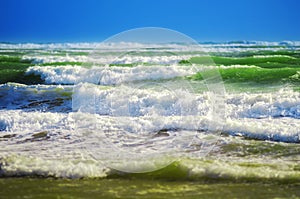 Choppy  whitewater waves pounding the beach