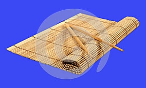 Chopsticks and bamboo mat