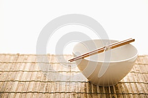 Chopsticks on an Empty Bowl. Isolated