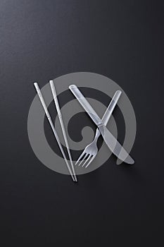 Chopsticks, fork and knife. Conceptual image