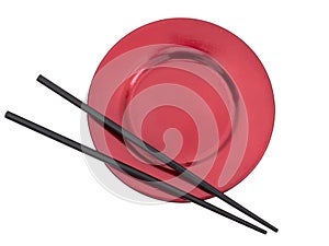 Chopsticks on red plate, isolated on white, with copyspace.