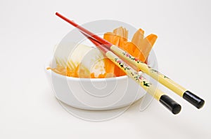 Chopsticks on a small bowl photo