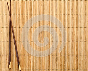 Chopsticks on straw mat