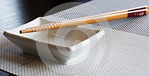 Chopsticks sushi with cup