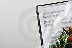 Choral christmas performance concept background with sheet music on table