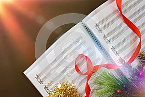 Choral christmas performance concept with sheet music and spotlight