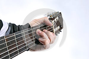 Chord playing classical guitar closeup