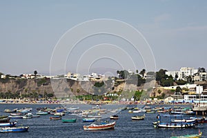 Chorillos Peru--Artisanal fishing port in the Pacific Ocean, in the background modern buildings