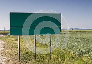 Chose your way billboard in field near road photo