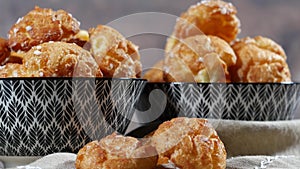 Chouquette, french choux pastry on the wooden table