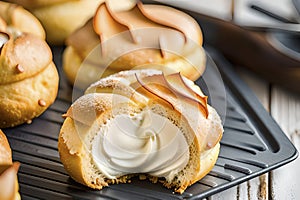 Choux au Craquelin: A display of choux pastry puffs, sugar-coated shells encasing cream filling photo