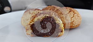 Choux au craquelin Pastry. Cake Chocolate photographed on table photo