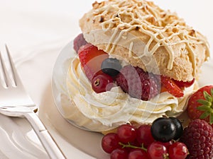 Choux Bun filled with Mixed Berries cream photo