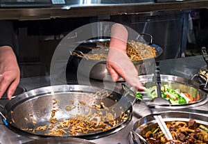 Chow mein served in metal wok