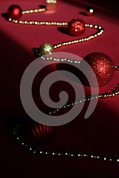 Chrisrmas tree decoration. A close up of a red and gold christmas tree decorations on red background. Christmas ball and