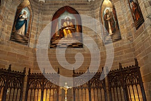 This is a Catholic Church ceiling with stained glass windows.