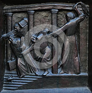Christ Driving the Merchants from the Temple, relief on the door of the Grossmunster church in Zurich