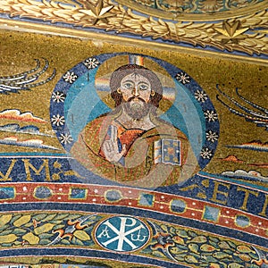Christ Pantocrator. Mosaic on the triumphal arch in the Apse in the Basilica of Saint Clement. Rome, Italy photo