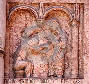 Christ Performing Works of Mercy relief at the baptistry in Parma