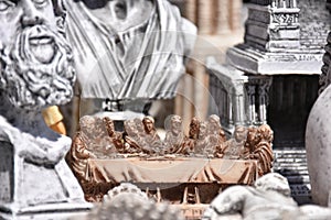 Christ`s Last Supper statue and small souvenir statues
