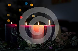 christian advent wreath with 4 burning candles