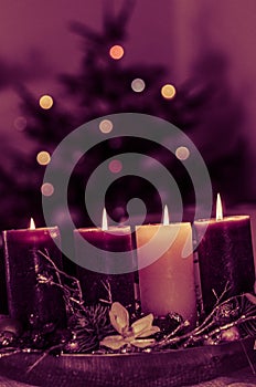 christian advent wreath with 4 burning candles