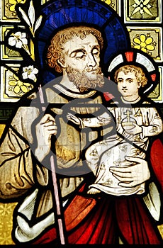 Colored stained leadlight church window Joseph holding baby Christ Jesus