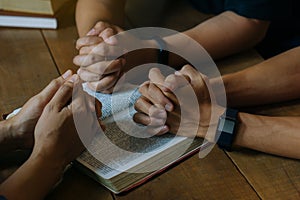 Christian Bible Study Concepts. Group of Christian read and study the bible together in a home. followers are studying the word of
