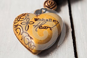 christian charm with message on wooden background