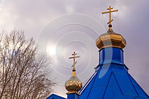 Christian church in Kemerovo with golden and gilded domes and bl