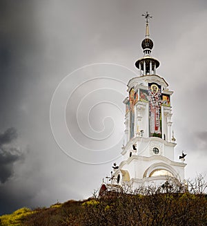 Christian church in storm clouds
