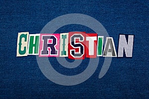 CHRISTIAN collage of word text, multi colored fabric on blue denim, Christianity religion diversity concept