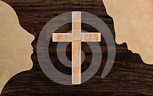 Christian couple pray concept cross wooden silhouette paper cut