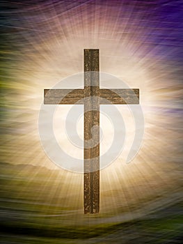 Christian cross on abstract landscape background with rays of glory. Religious Easter.