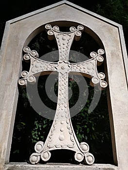 Christian cross with arc made of white stone in Primorski-Park Varna Bulgaria