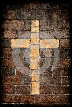 Christian cross in brick wall