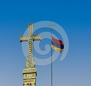 Religious cross and Armenian flag on sky