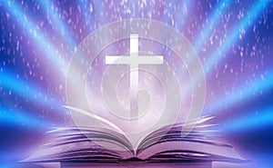 The Christian Cross is illuminated in a book in white and fantasy light, with magic shining as hope, love and freedom in beautiful