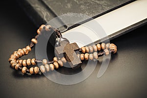 Christian cross necklace on Holy Bible book, Jesus religion concept as good friday or easter festival