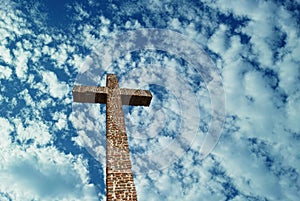 Christian Cross over bright sky